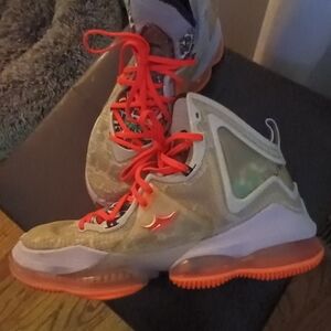 Stylish High-Top Sneakers with Orange Accents